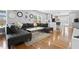 Stylish living room with hardwood floors, a sectional sofa, and view to the kitchen at 992 Beckwith Sw St, Atlanta, GA 30314