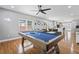 Spacious living room featuring a pool table, hardwood floors, and stylish decor at 992 Beckwith Sw St, Atlanta, GA 30314