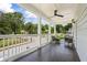 Inviting porch with ceiling fan, outdoor seating, and neighborhood views at 992 Beckwith Sw St, Atlanta, GA 30314