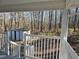 View of the backyard with a shed and wooded area, seen from the home's porch with white railing at 1610 Mulberry Rock Rd, Dallas, GA 30157