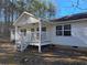 Exterior of a cozy home with a welcoming porch and well-maintained surroundings at 1610 Mulberry Rock Rd, Dallas, GA 30157