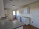 Well-lit kitchen with ample counter space and clean white cabinetry, perfect for meal preparation at 1610 Mulberry Rock Rd, Dallas, GA 30157
