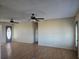 Bright living room with two ceiling fans and laminate flooring, creating a comfortable atmosphere at 1610 Mulberry Rock Rd, Dallas, GA 30157