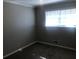 Cozy bedroom featuring plush carpet, a window, and neutral paint at 1731 Dogwood Trl, Douglasville, GA 30134