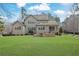 Beautiful backyard with lush green lawn and patio, perfect for outdoor relaxation at 7740 Nesbit Ferry Rd, Atlanta, GA 30350