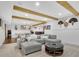 Finished basement with two seating areas, ping pong table, beams and accent lighting at 7740 Nesbit Ferry Rd, Atlanta, GA 30350
