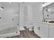 Bathroom boasts a glass shower, white shiplap walls, and stylish tile floors for modern comfort at 7740 Nesbit Ferry Rd, Atlanta, GA 30350