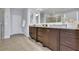 Bathroom featuring double vanity with granite countertops and modern fixtures at 7740 Nesbit Ferry Rd, Atlanta, GA 30350