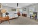 Well-lit bedroom with a cozy bed, complemented by classic furnishings and neutral decor at 7740 Nesbit Ferry Rd, Atlanta, GA 30350