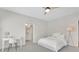 Spare bedroom with white walls, a white bed, and views to an en-suite bathroom at 7740 Nesbit Ferry Rd, Atlanta, GA 30350