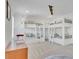 Bedroom features three built-in bunk beds, and white shiplap wall accents and plush carpeting at 7740 Nesbit Ferry Rd, Atlanta, GA 30350