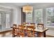 Dining room with windows letting in natural light and wood dining table at 7740 Nesbit Ferry Rd, Atlanta, GA 30350