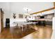 Spacious game room with a ping pong table, shuffleboard, and wet bar, ideal for entertaining at 7740 Nesbit Ferry Rd, Atlanta, GA 30350