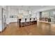 Spacious kitchen features white cabinets, hardwood floors, stainless steel appliances, and a large center island at 7740 Nesbit Ferry Rd, Atlanta, GA 30350