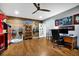 Office with a hardwood floor, overhead fan and lighting, with a desk and display case at 7740 Nesbit Ferry Rd, Atlanta, GA 30350