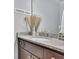 Stylish powder room featuring a granite countertop and decorative accents at 7740 Nesbit Ferry Rd, Atlanta, GA 30350