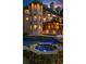 The home's backyard features a multi-level stone patio with a pool, spa, and ample room for entertaining at 1525 Lockridge Dr, Cumming, GA 30041