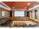 Home theater in basement with large screen, wooden built-ins, and comfortable seating at 1525 Lockridge Dr, Cumming, GA 30041