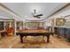 Basement entertainment area with a pool table, bar, and natural light at 1525 Lockridge Dr, Cumming, GA 30041
