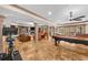 Finished basement with a pool table, fireplace, and comfortable seating at 1525 Lockridge Dr, Cumming, GA 30041