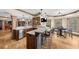 Finished basement includes a wet bar with a granite countertop, stainless steel appliances, and game table at 1525 Lockridge Dr, Cumming, GA 30041