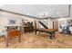 Basement recreation area with a pool table, bar, and workout equipment at 1525 Lockridge Dr, Cumming, GA 30041