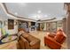 Basement living area with a fireplace, TV, and comfortable leather seating at 1525 Lockridge Dr, Cumming, GA 30041
