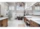 Vaulted bathroom with a soaking tub, walk-in shower, dual vanities, and custom tile work at 1525 Lockridge Dr, Cumming, GA 30041