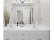 Bathroom featuring double sinks and large mirror at 1525 Lockridge Dr, Cumming, GA 30041