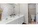 Neutral bathroom with double vanity, large mirror, and tiled floors at 1525 Lockridge Dr, Cumming, GA 30041