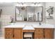 Bathroom with dual wooden vanity, and a large mirror at 1525 Lockridge Dr, Cumming, GA 30041