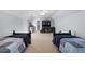 Spacious bedroom featuring twin beds and a study area with built-in shelves at 1525 Lockridge Dr, Cumming, GA 30041