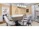 Cozy dining room featuring modern lighting, wainscoting, and light-colored walls at 1525 Lockridge Dr, Cumming, GA 30041