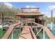 Covered boat dock with lift system, offering easy access to the water for boating and lake activities at 1525 Lockridge Dr, Cumming, GA 30041