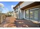 Back exterior view of home with large deck and patio at 1525 Lockridge Dr, Cumming, GA 30041