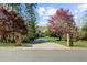 Long driveway leading to the home, flanked by stone pillars and manicured lawn at 1525 Lockridge Dr, Cumming, GA 30041