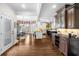 Gourmet kitchen featuring dark wood cabinets, granite countertops, and stainless steel appliances at 1525 Lockridge Dr, Cumming, GA 30041
