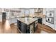 Open concept kitchen with island, granite countertops, custom cabinetry, and modern appliances at 1525 Lockridge Dr, Cumming, GA 30041