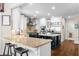 Bright kitchen with white cabinets, granite countertops, and a stainless steel refrigerator at 1525 Lockridge Dr, Cumming, GA 30041