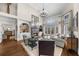 Spacious living room with a fireplace, built-in shelving, and large windows at 1525 Lockridge Dr, Cumming, GA 30041