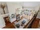 Open concept living room with fireplace, ample natural light and access to the deck at 1525 Lockridge Dr, Cumming, GA 30041