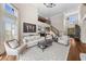 Bright living room with high ceilings, hardwood floors, and elegant furniture at 1525 Lockridge Dr, Cumming, GA 30041