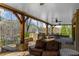 Expansive covered patio with an outdoor kitchen, built-in grill, and comfortable seating at 1525 Lockridge Dr, Cumming, GA 30041