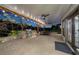 An outdoor kitchen on a paver patio featuring a built-in grill and ceiling fans for comfort at 1525 Lockridge Dr, Cumming, GA 30041