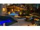 An inviting outdoor oasis with a pristine pool, elegant patio, and cozy lounge area under a covered deck at 1525 Lockridge Dr, Cumming, GA 30041