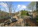Inviting pool with lounge chairs, a hot tub, and scenic lake views at 1525 Lockridge Dr, Cumming, GA 30041