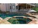 Backyard pool and spa with stone coping and a deck with staircase at 1525 Lockridge Dr, Cumming, GA 30041