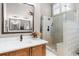 Bathroom with walk in shower and wood vanity at 1525 Lockridge Dr, Cumming, GA 30041
