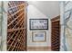 Wine cellar with wooden racks for storage and unique stone and wood design at 1525 Lockridge Dr, Cumming, GA 30041
