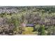 Aerial view of the home with mature trees, long driveway, and a sprawling green lawn, providing curb appeal at 2415 Bankstone Sw Dr, Marietta, GA 30064